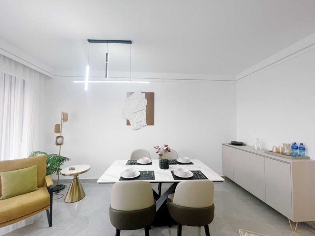 the dining area set for four at the 2 bedroom furnished apartment near juction mall