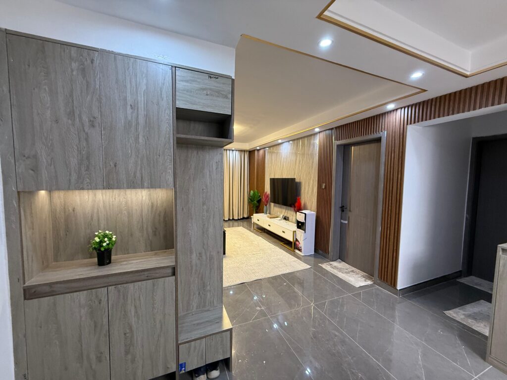 view of the mounted smart Tv and a console from a far at Furnished Apartment at Alina Harbour Kilimani