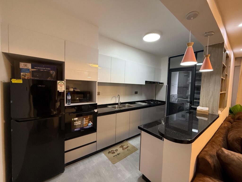 A fitted open plan kitchen at Furnished apartment at Alina Harbour Kilimnai with Appliances
