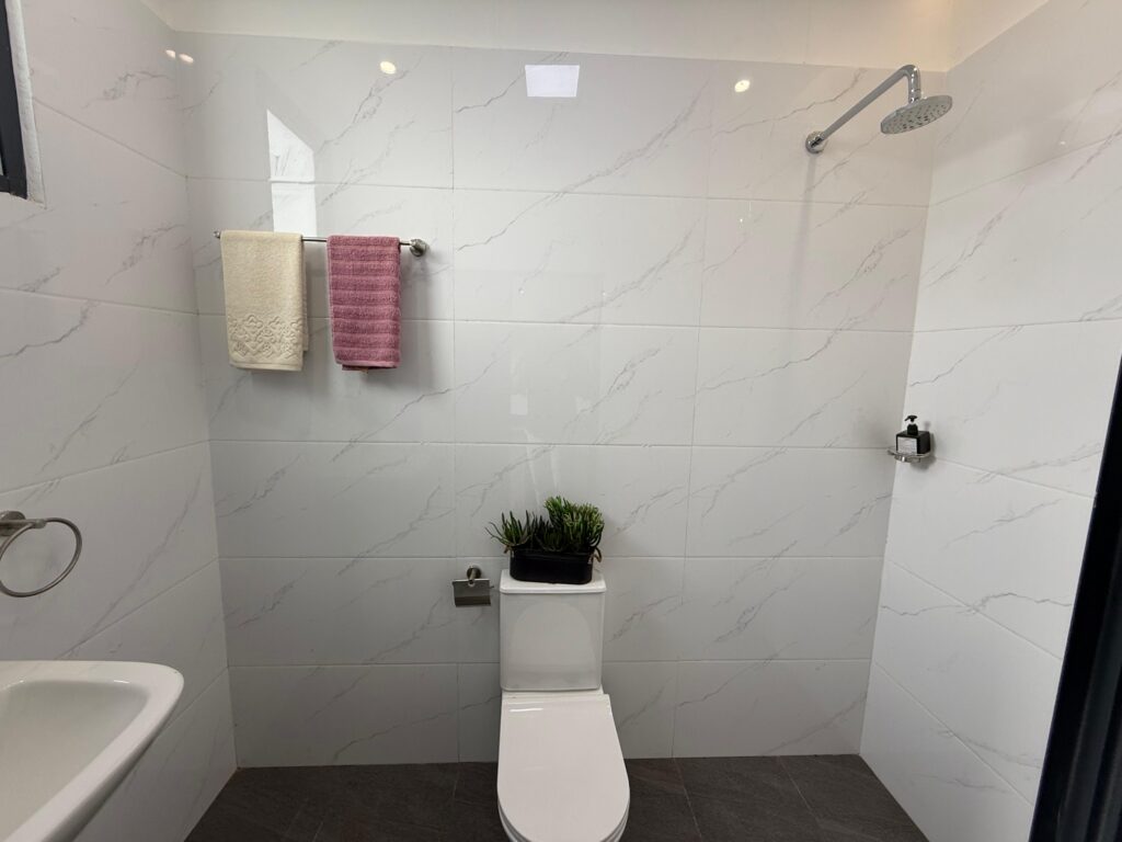 An expansive bedroom at the superior studio at Astra Bay