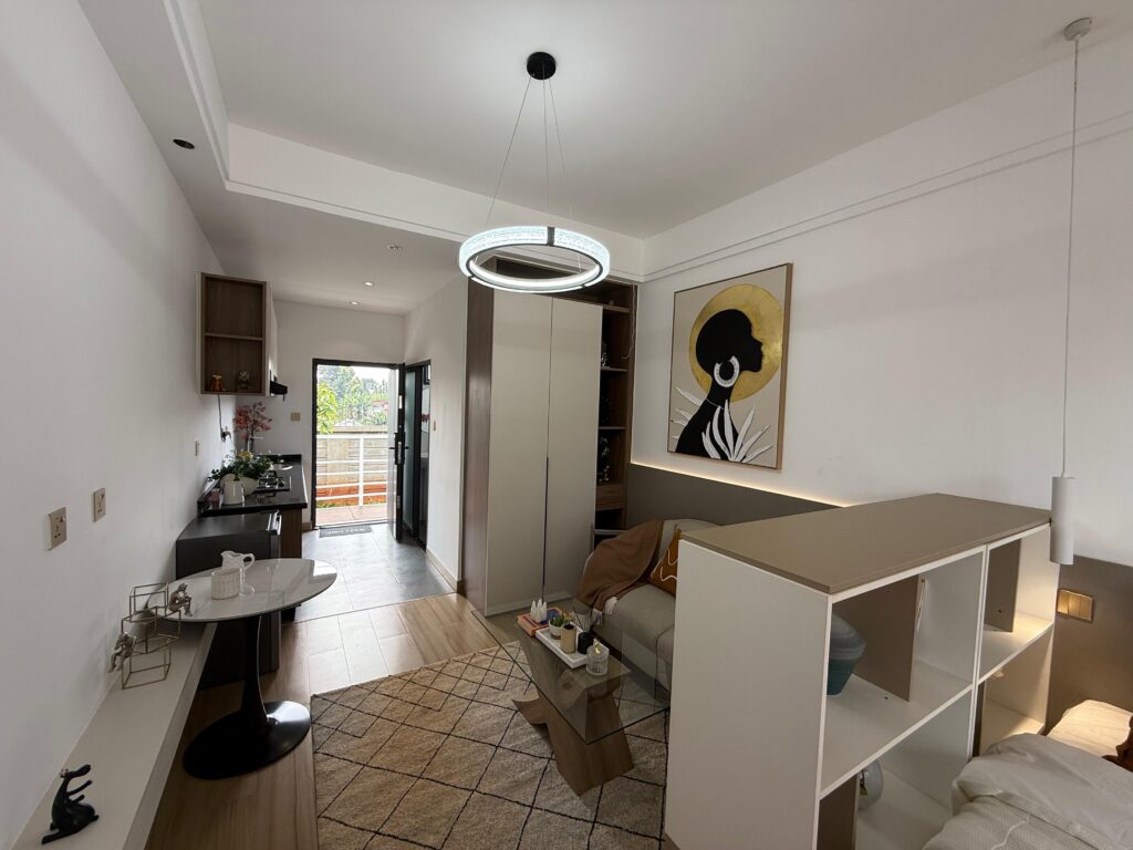 superior studio at astra bay with fitted cabinets both in the kitchen area and the sleeping area in a superior studio at Astra Bay