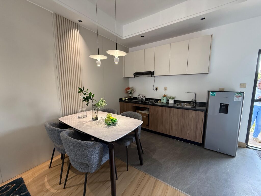Open plan kitchen with a medium dining table at 1 Bedroom Apartment Along Lower Kabete Road