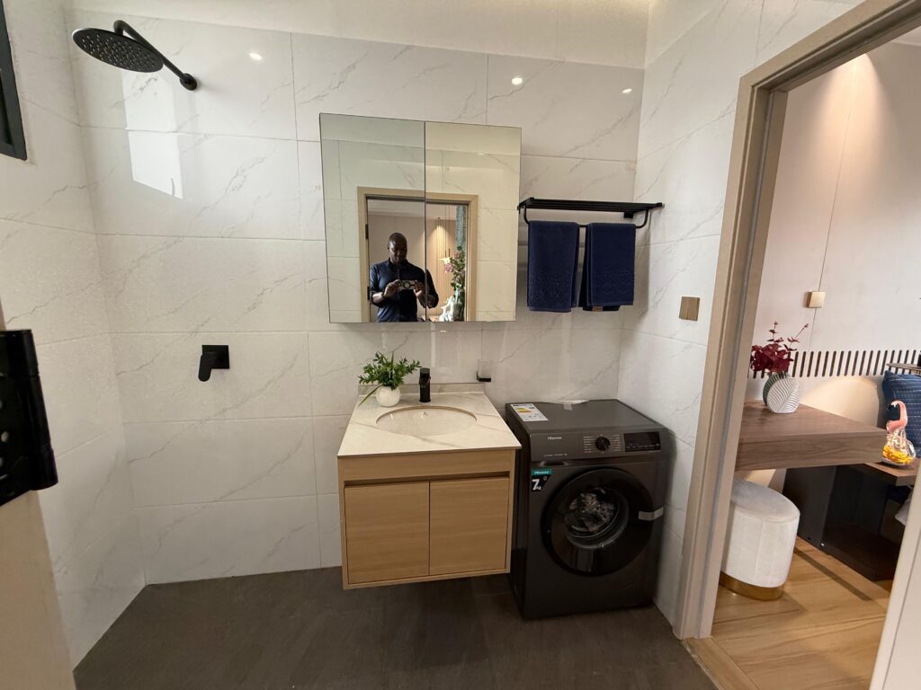 A bathroom sink with a mirror at 1 Bedroom Apartment Along Lower Kabete Road