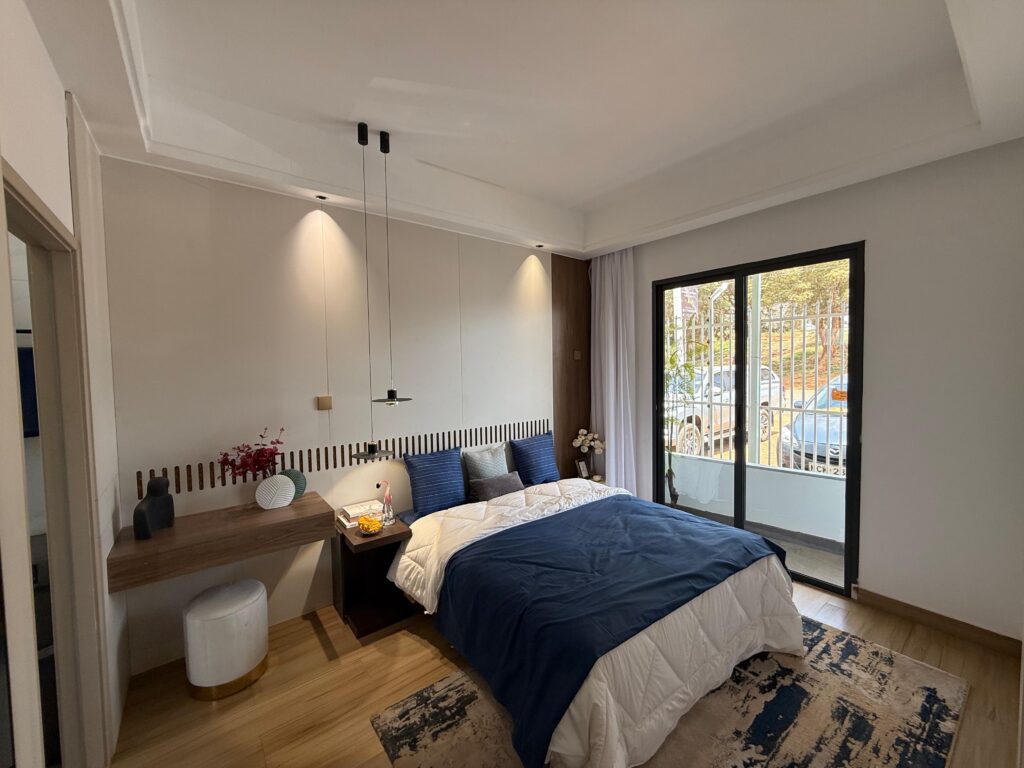 Bedroom with large windows at the 1 Bedroom Apartment Along Lower Kabete Road