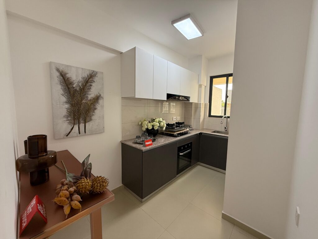 A fitted open plan kitchen at One Bedroom Apartment on Gataka Road