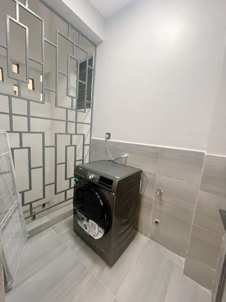 laundry area with a washing machine at Furnished apartment on riara road