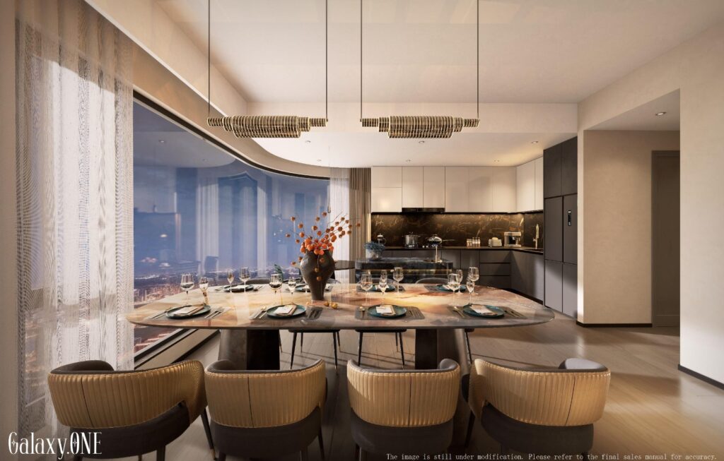 Dining area with an open plan kitchen in the backround inside an apartment at Galaxy ONE