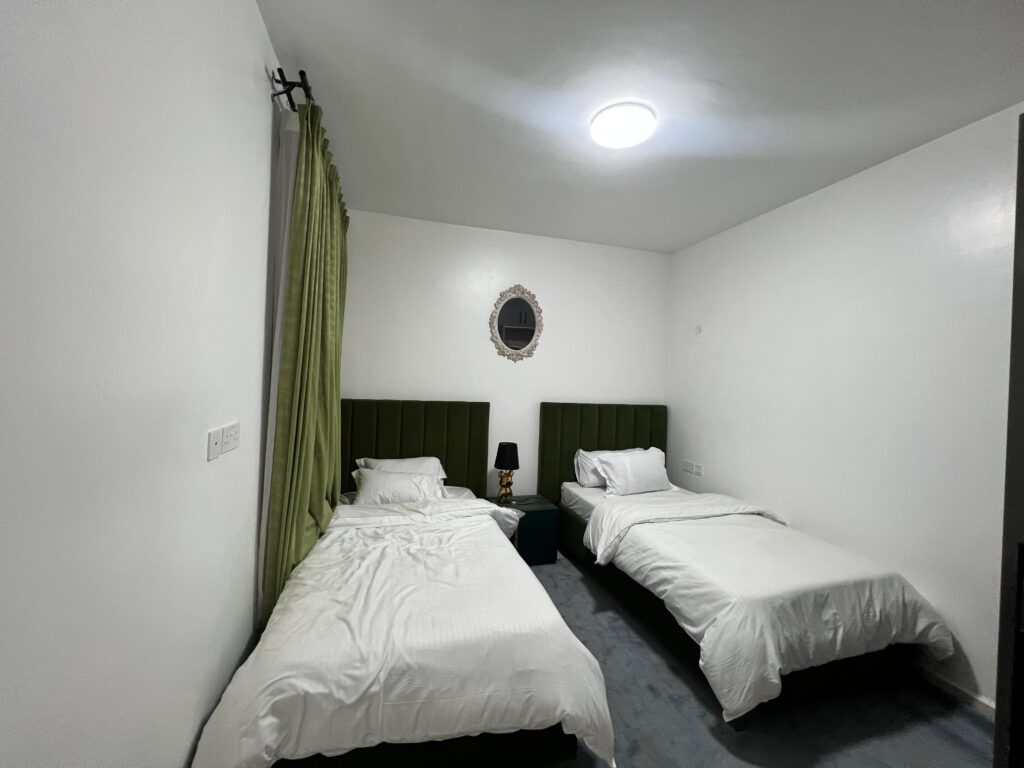 a bedroom well lit at an apartment in Isra Residency Parklands