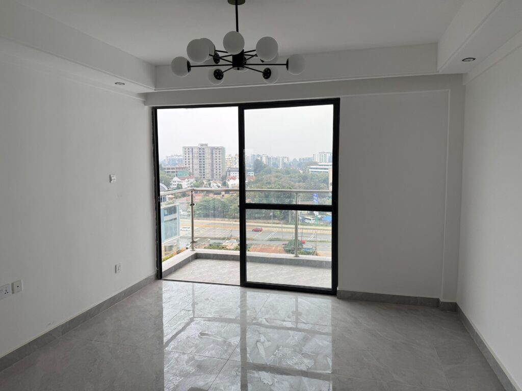 sliding large windows leading to a private balcony at Unfurnished 1 Bedroom Apartment Near Nairobi Expressway