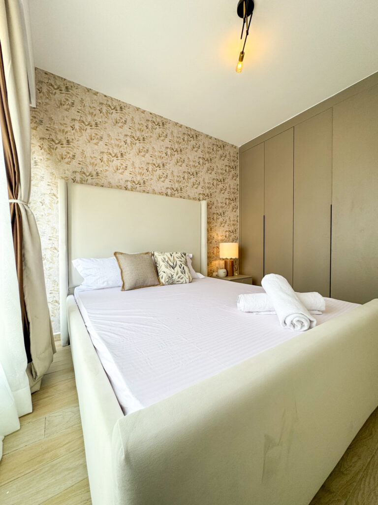 bedroom well lit with the view of inbuilt wardrobes for storage at furnished apartment at southpark apartment