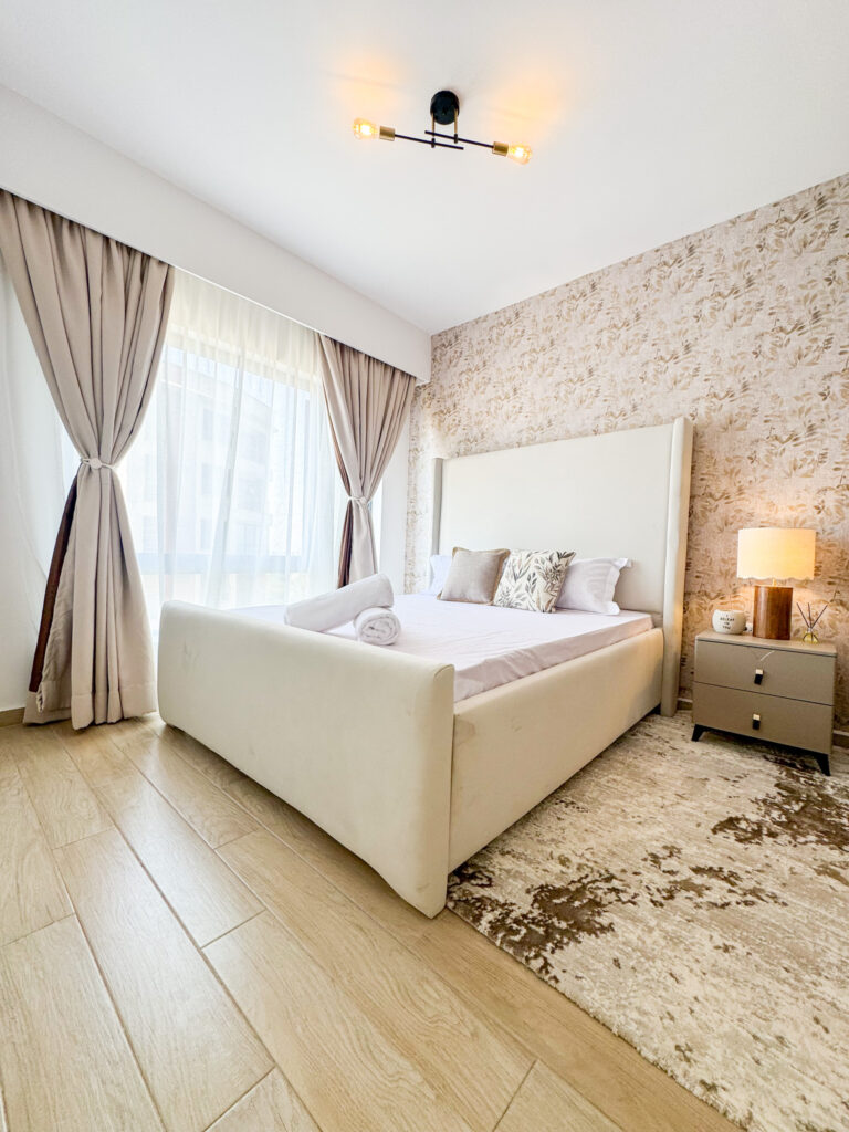 a beautiful bedroom with a king size plush bed and white linen at furnished apartment at southpark apartment