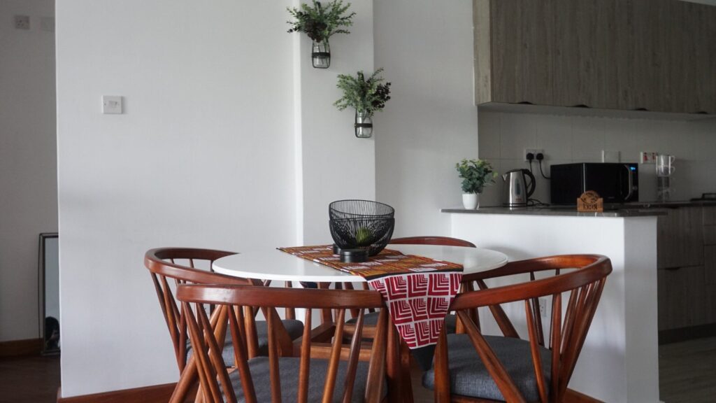 A dining area inside an apartment at Angani By Residency