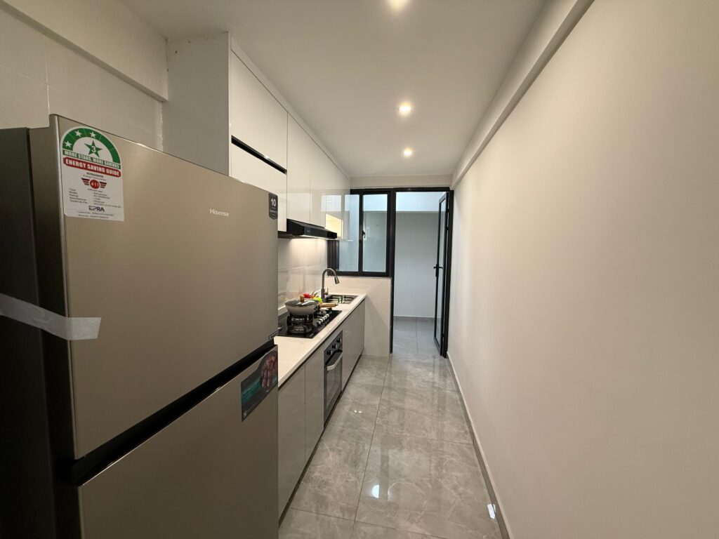 An open plan kitchen with fitted cabinets at the Two Bedroom Apartment Near Nyeri Road