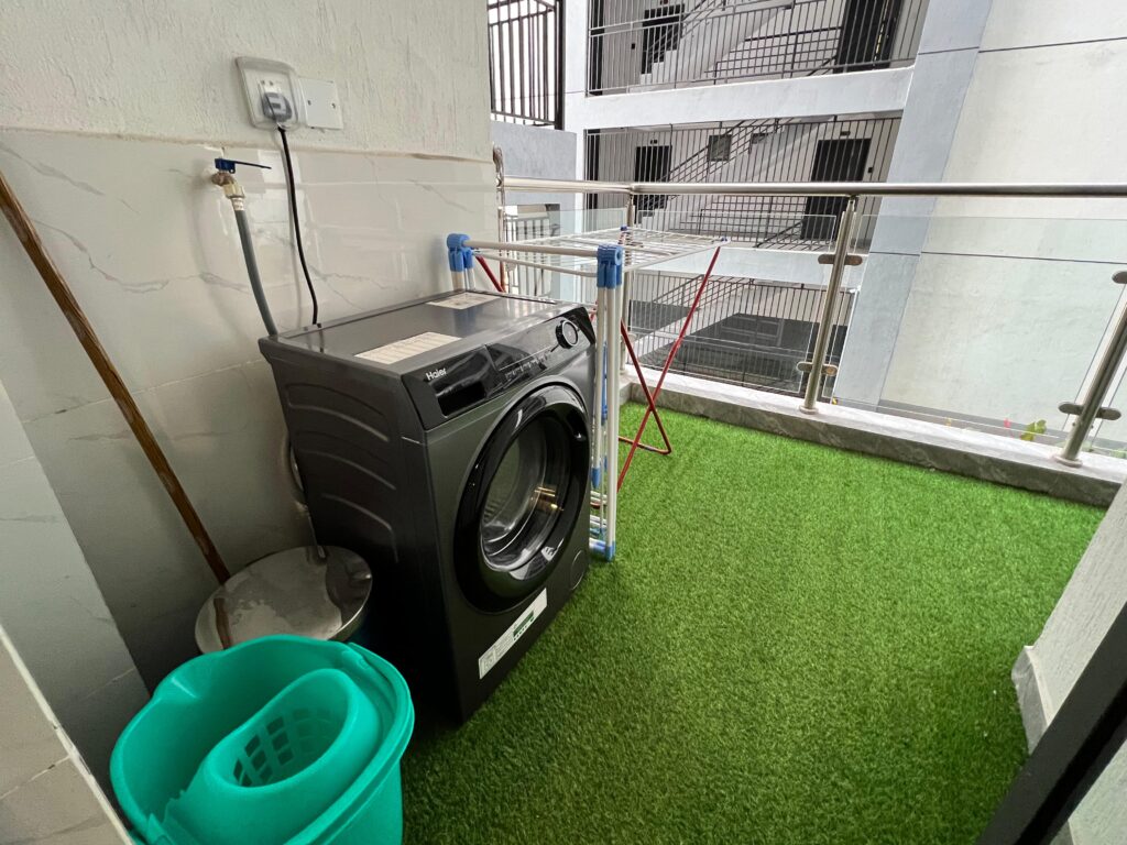 the laundry area with a washing machine at the Furnished apartment at winchester Gardens