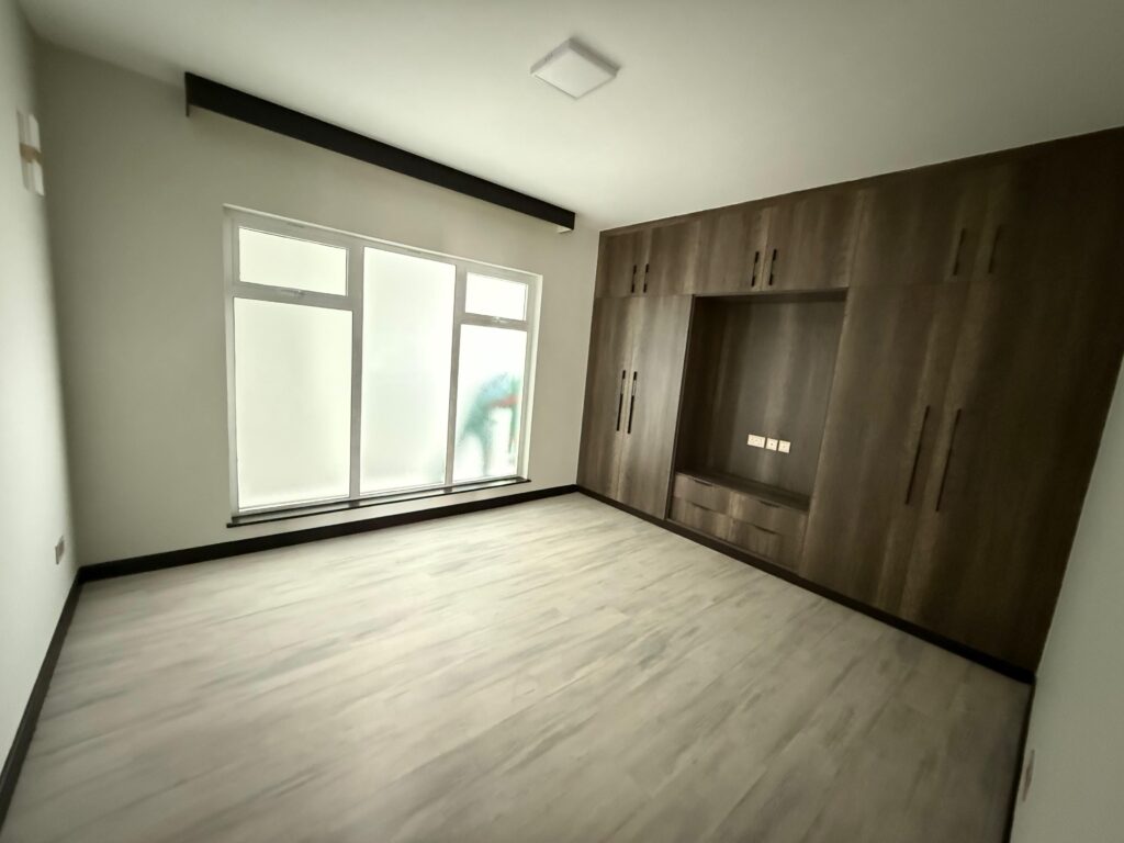 A soft bright bedroom from natural large window lighting in the Pearl Rivers unfurnished 2 bedroom
