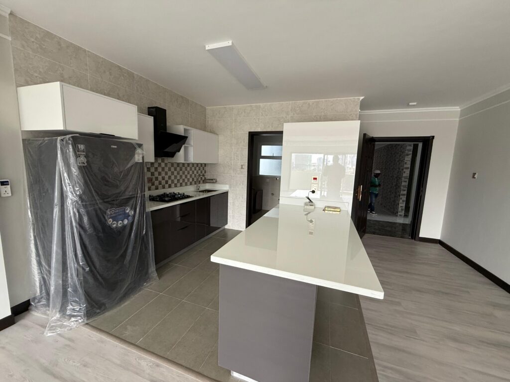 Expansive open plan kitchen with fitted cabinets and counter tops at the Pearl Rivers unfurnished 2 bedroom