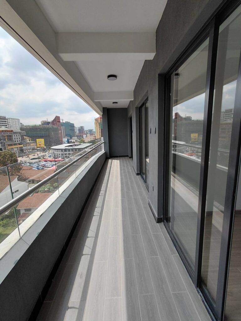 a bedroom at the Unfurnished 2 Bedroom Apartment on George Padmore Road expansive balcony