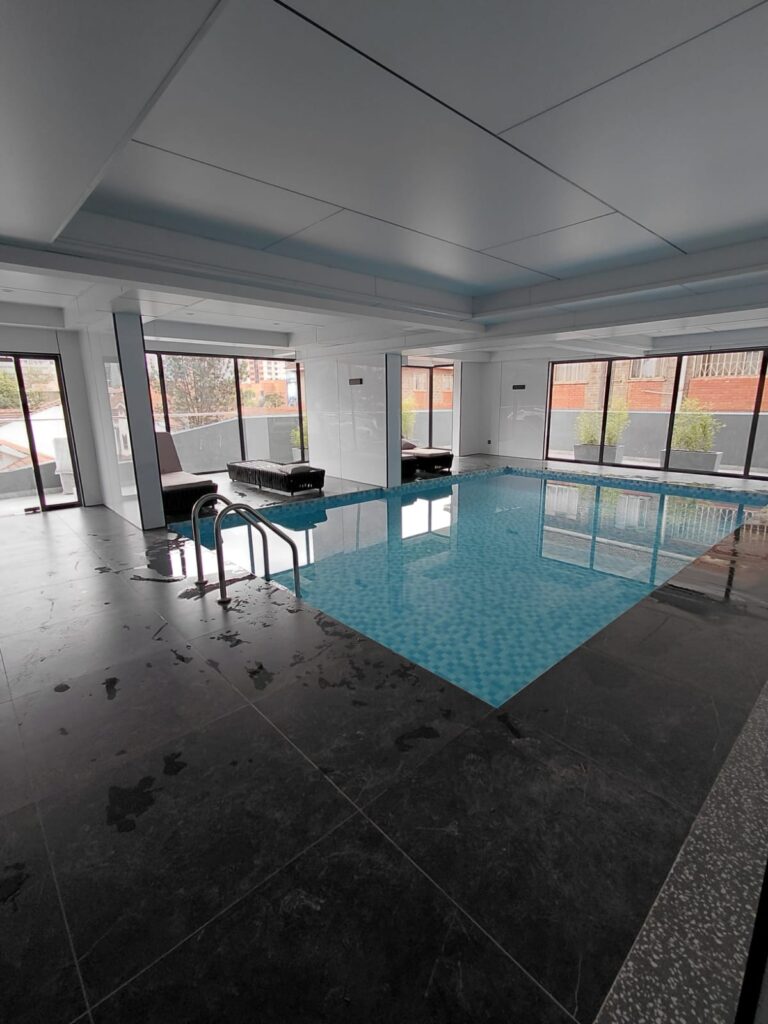 an indoor swimming pool at the Unfurnished 2 Bedroom Apartment on George Padmore Road