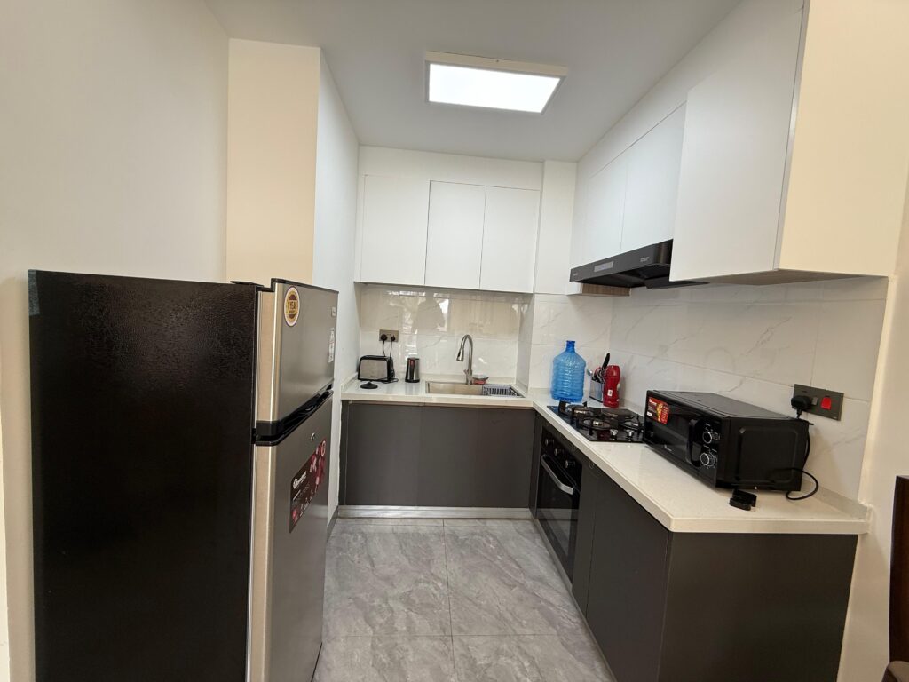 A furnished kitchen at Furnished 2 bedroom Apartment at Capital Rise