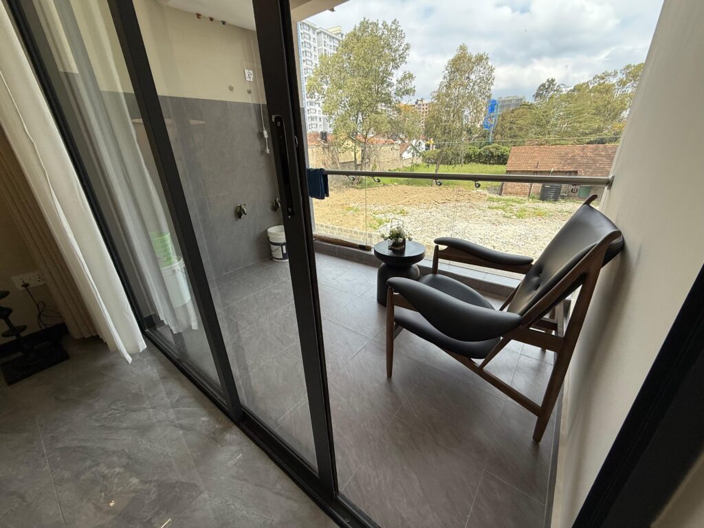 large windows opening to a balcony at Two Bedroom Apartment on Wood Avenue