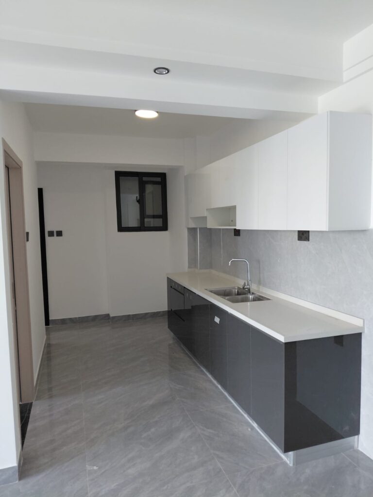 Open plan kitchen at Unfurnished 1 Bedroom With a Study at Serenity Residences